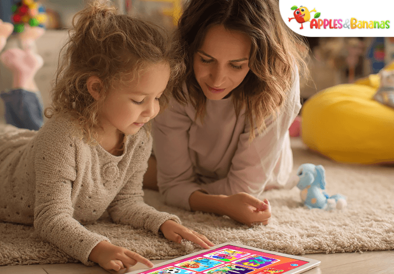 Child using the Apples and Bananas learning app on a tablet at home