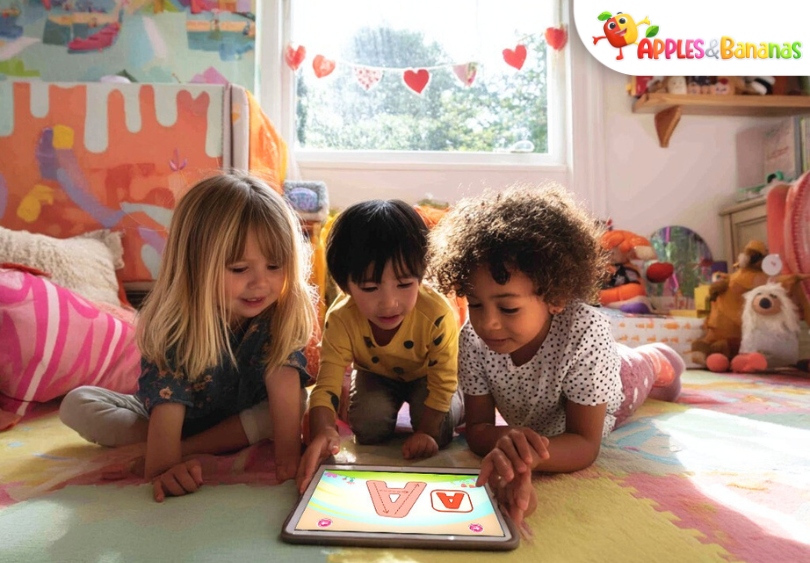 Toddler playing an educational game to learn colors and shapes on a tablet