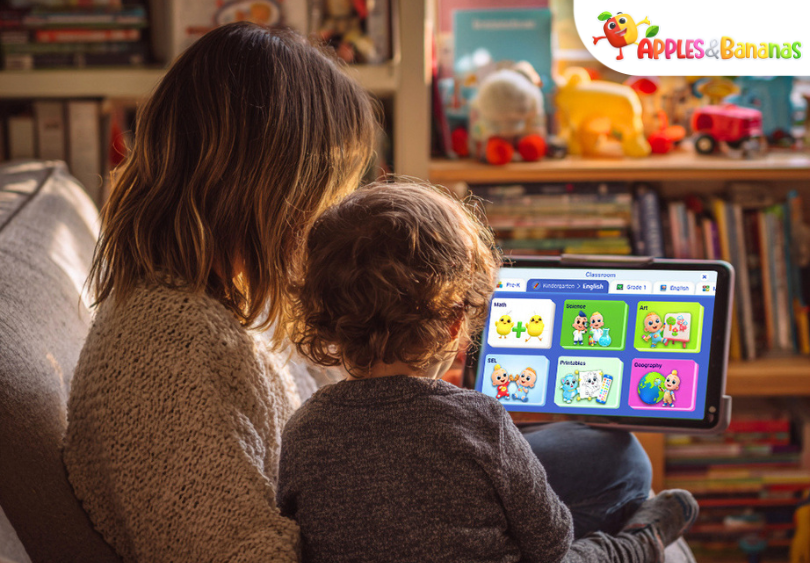 Mother helping child use a kids learning app for phonics on a tablet at home